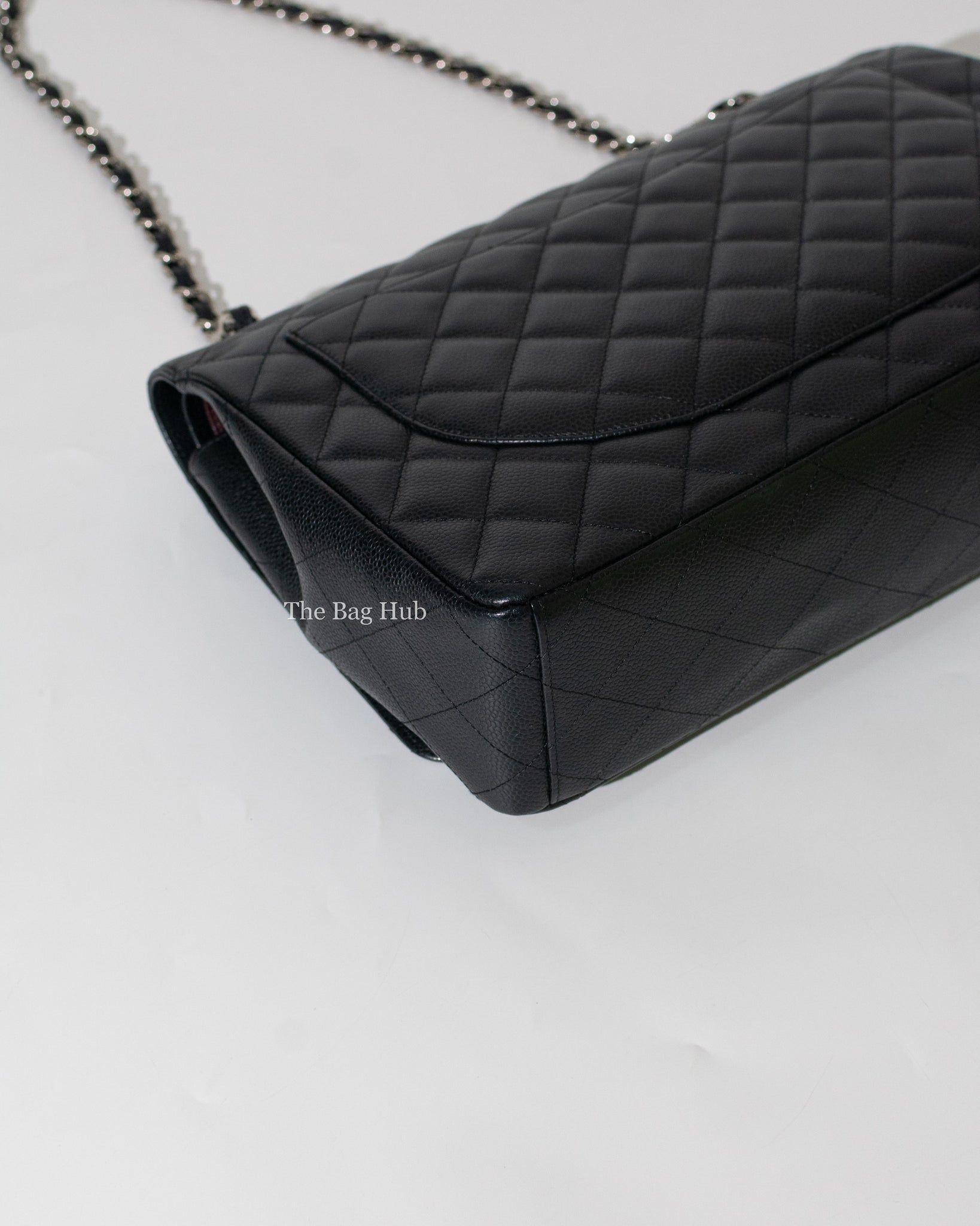 CHANEL, a black caviar leather shoulder bag, Double Flap Maxi. - Bukowskis